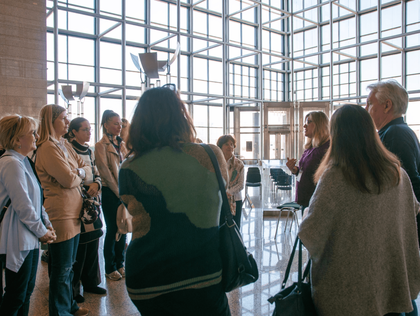 Member of the NSK Information Centre giving a group of visitors a guided tour of NSK, the National and University Library in Zagreb.