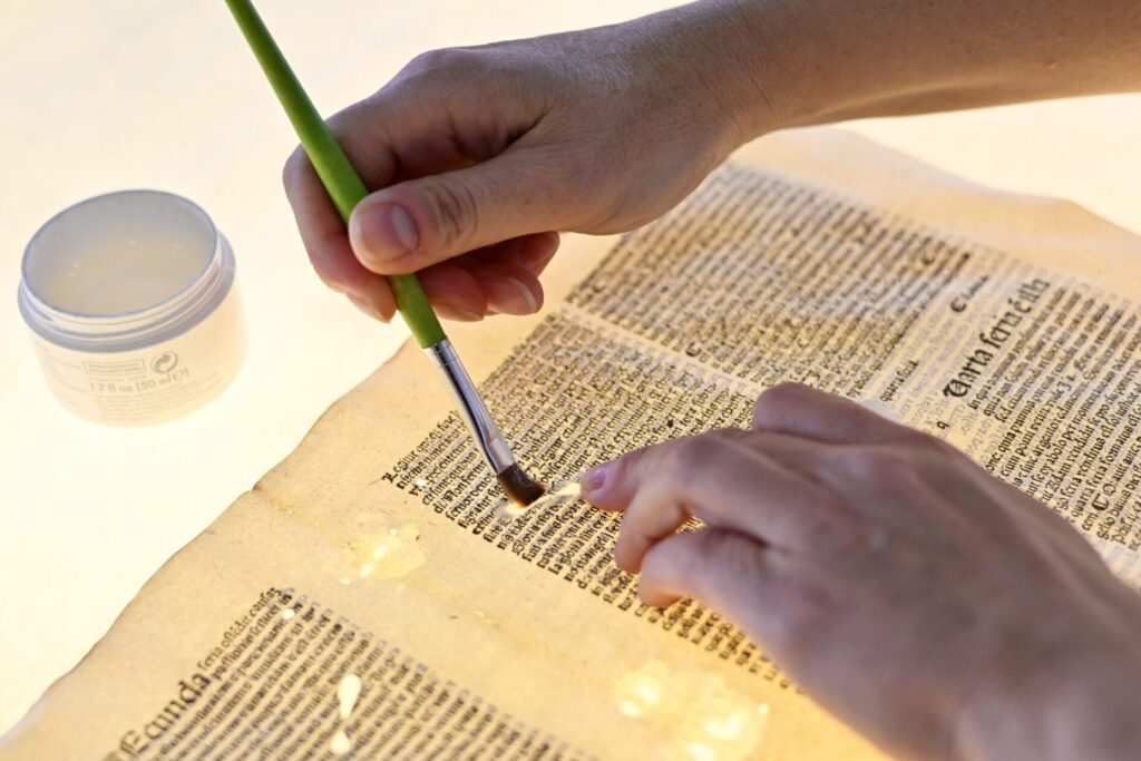 NSK conservation specialist working on the restoration of an item from NSK’s collections.
