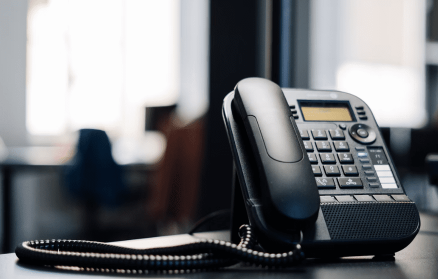 Telephone on a desk.