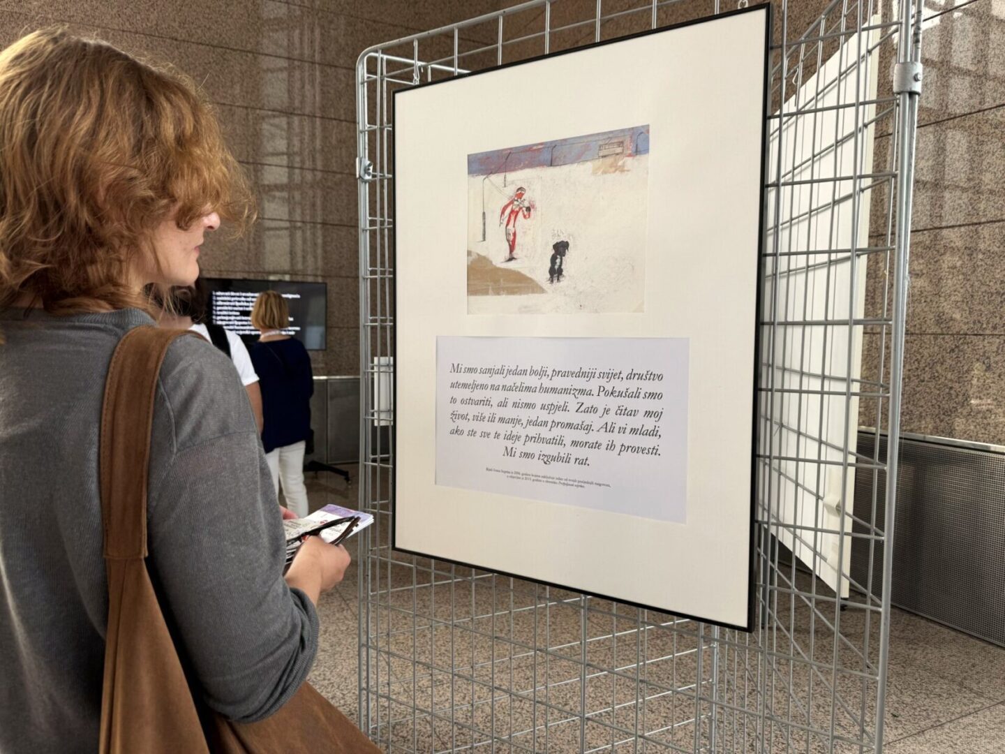 “The world we dreamt of…” exhibition on view at NSK by 27 June 2025 Visitor at the “The world we dreamt of…” exhibition.